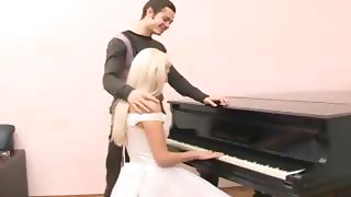 Pummeling the bride that sits at the piano