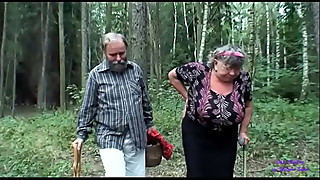 The girl looking for mushrooms sees an older lady with big tits fucking with her old husband and gets very horny